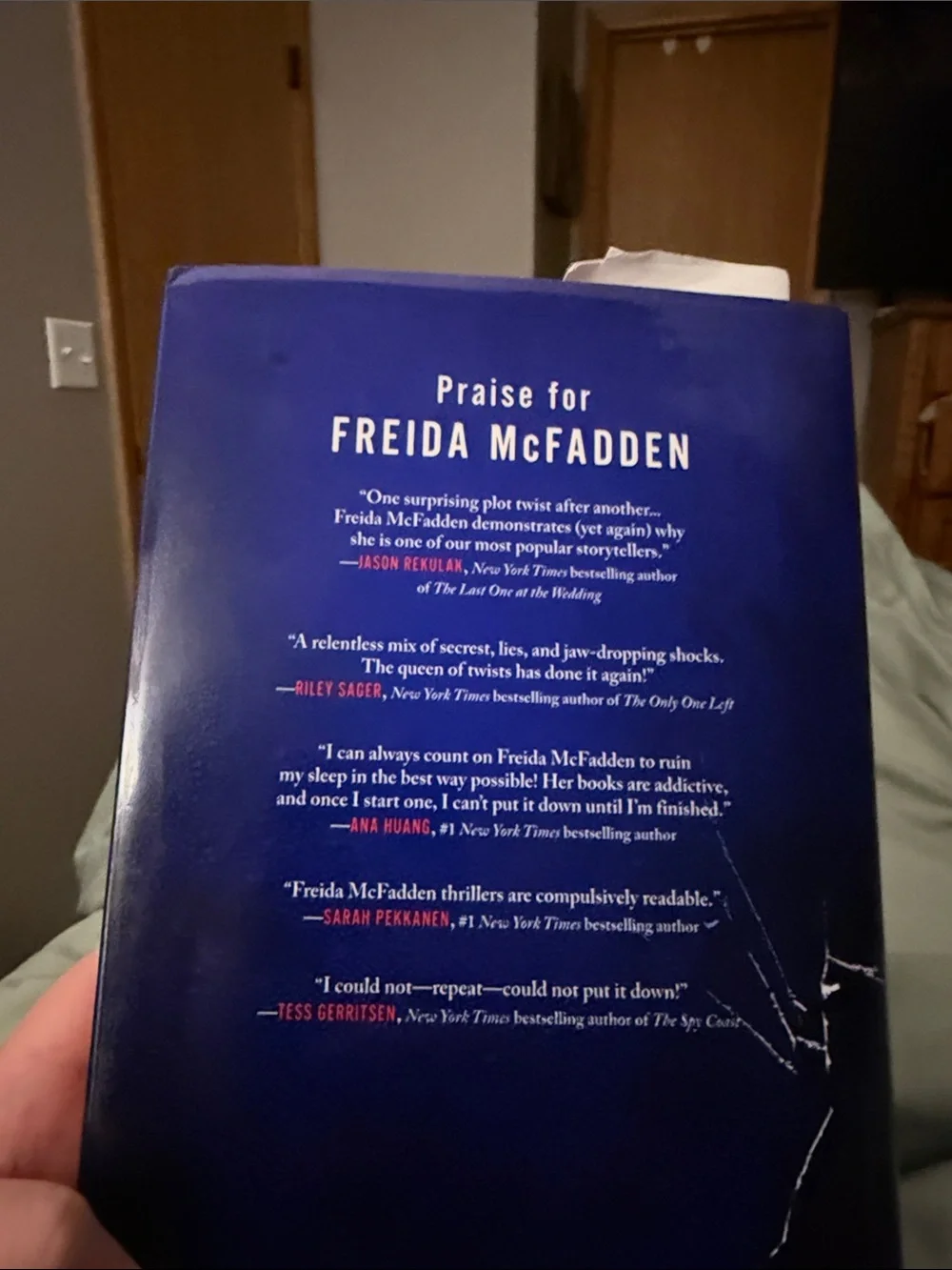 Freida McFadden "The Intruder" Hardcover - Navy & Red Cover - Picture 3 of 3
